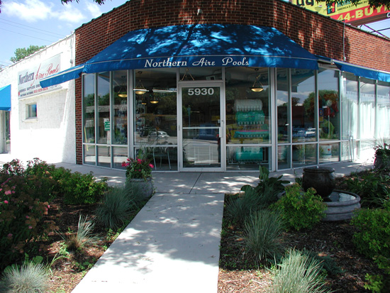 Texas Recreation pool lounges and chairs on display inside the Northern Aire Pools store.
